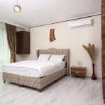 a bedroom featuring a newly installed split system air conditioner, representing split system installation Melbourne.