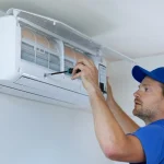 air conditioning technician conducting urgent repairs, representing emergency air conditioning repair melbourne.