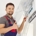 air conditioning technician repairing a split system air con, representing split system repair Melbourne