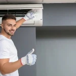 air con technician servicing a split system, representing split system service Melbourne