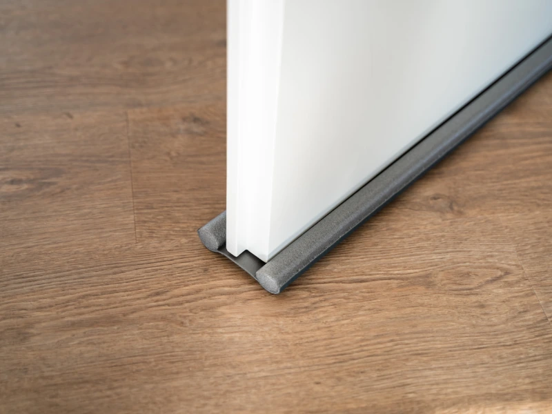double-sided door draft stopper attached to door