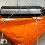 air conditioner being cleaned