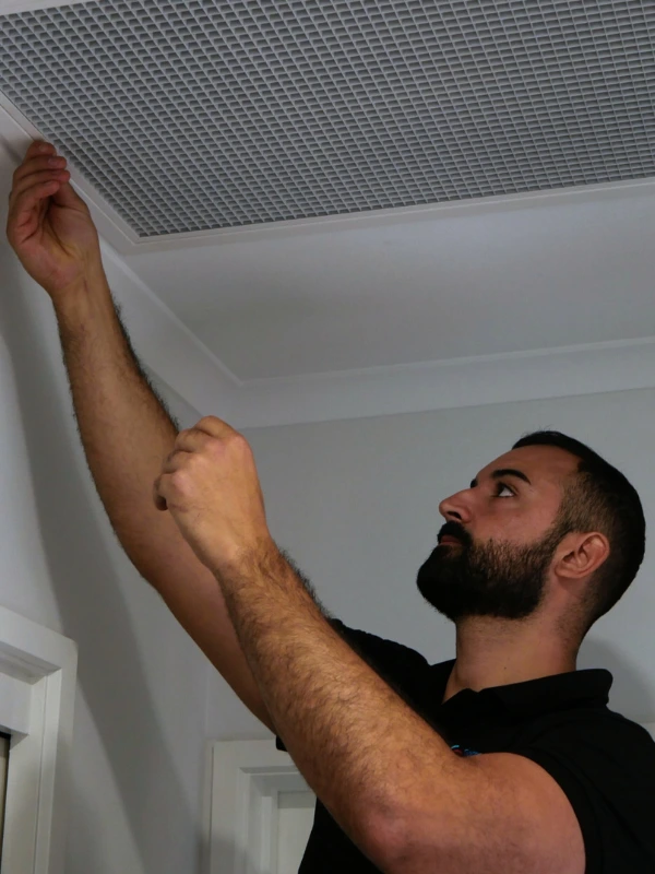home-technician-inspecting-AC